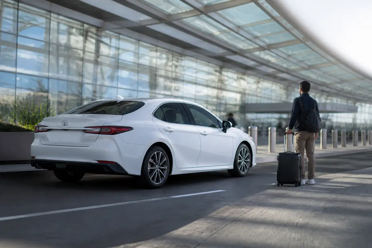 Airport traveler meeting a prearranged ride outside an SFO terminal